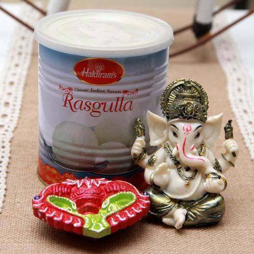 Ganesh Idol Haldiram Rasgulla and terracotta Diya - YuvaFlowers